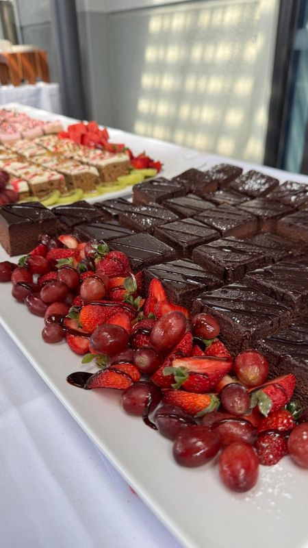 Dessert table with strawberries and slices