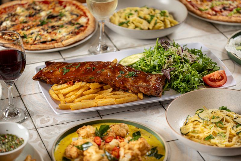 BBQ baby back pork ribs with chips and salad